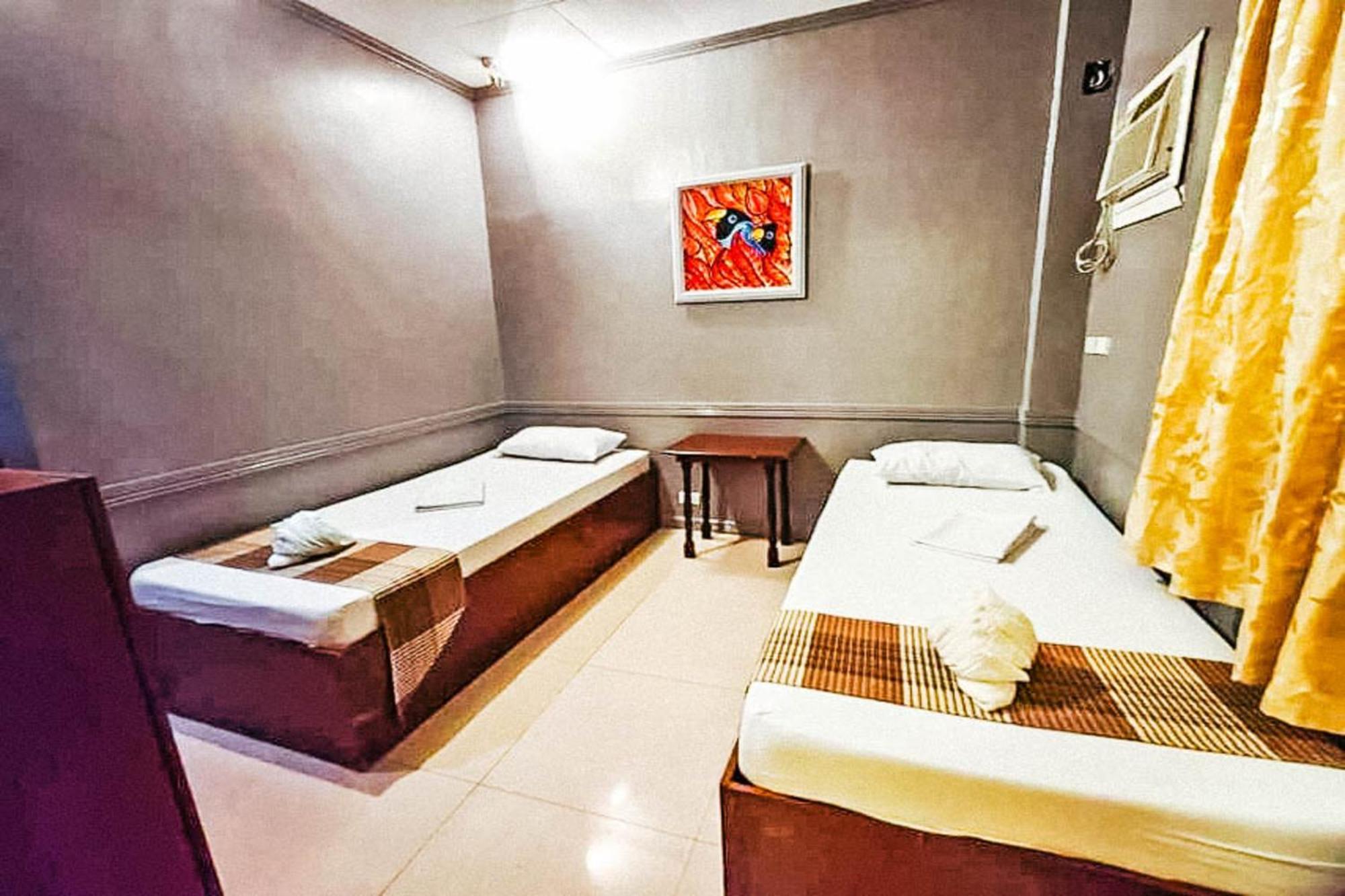 Mbg Travellers Inn Powered By Cocotel Puerto Princesa Habitación foto