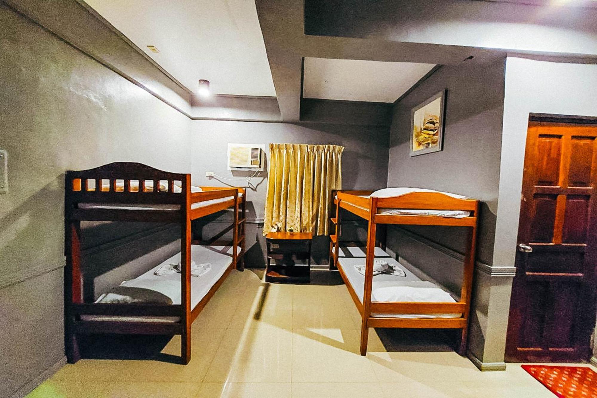 Mbg Travellers Inn Powered By Cocotel Puerto Princesa Habitación foto