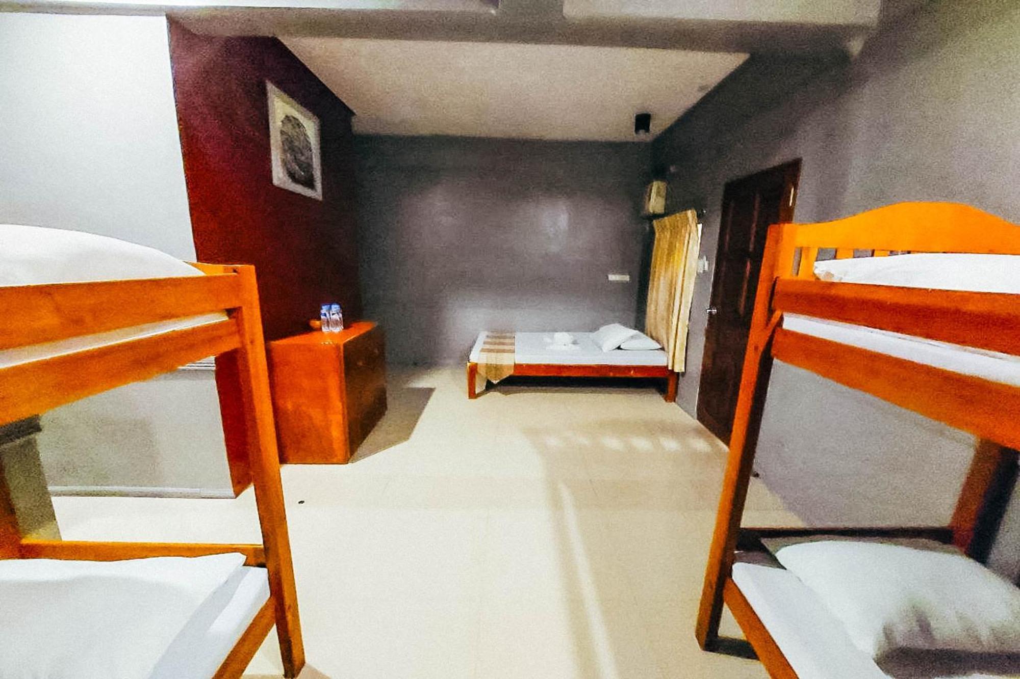 Mbg Travellers Inn Powered By Cocotel Puerto Princesa Habitación foto