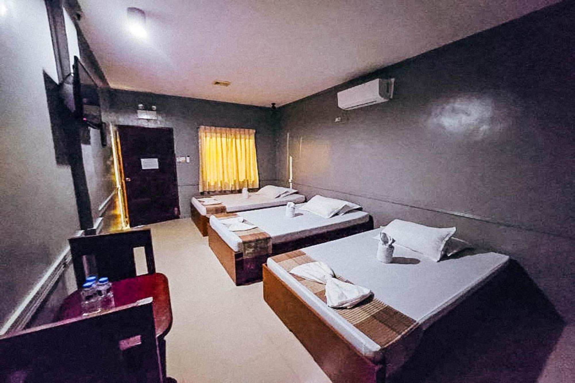 Mbg Travellers Inn Powered By Cocotel Puerto Princesa Habitación foto