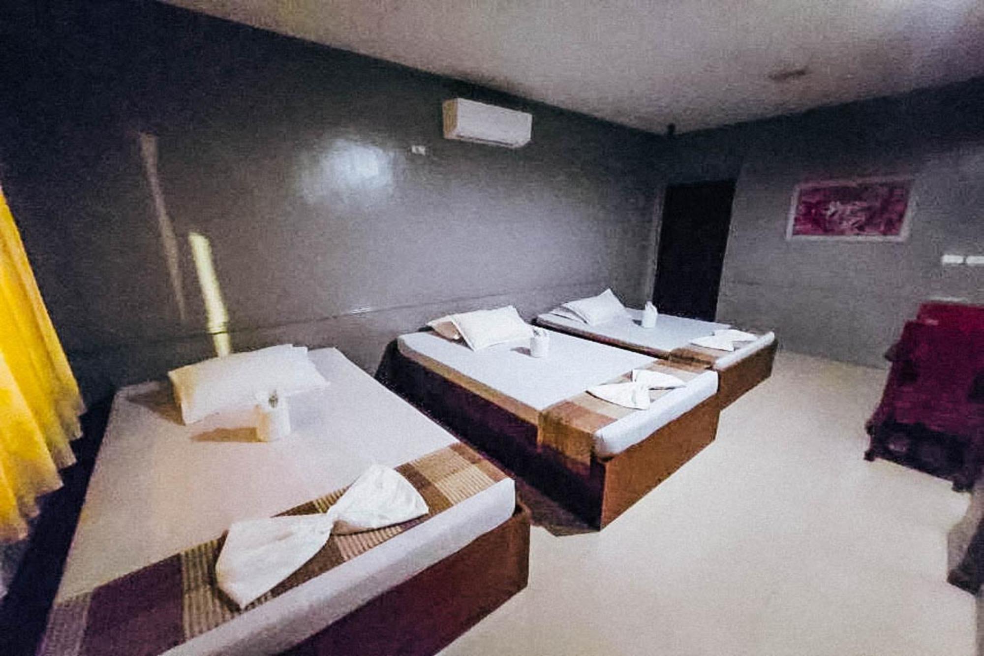 Mbg Travellers Inn Powered By Cocotel Puerto Princesa Habitación foto