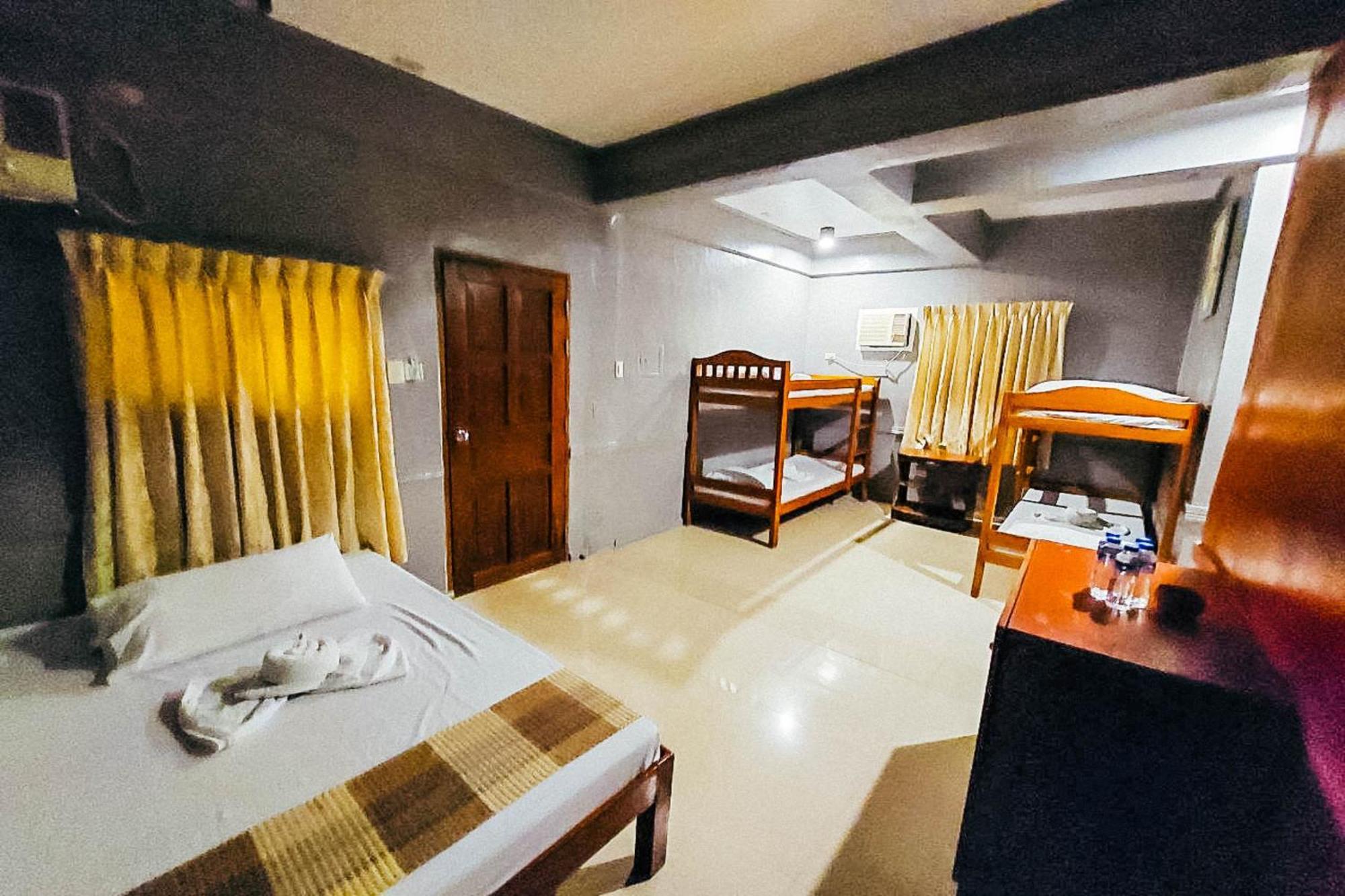 Mbg Travellers Inn Powered By Cocotel Puerto Princesa Habitación foto