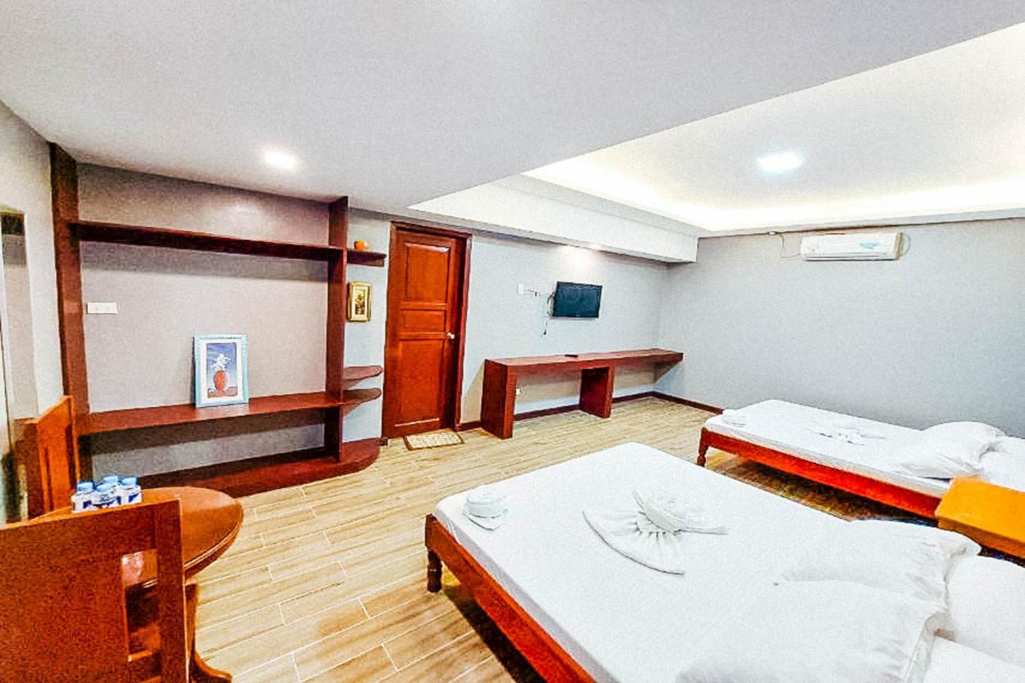 Mbg Travellers Inn Powered By Cocotel Puerto Princesa Habitación foto