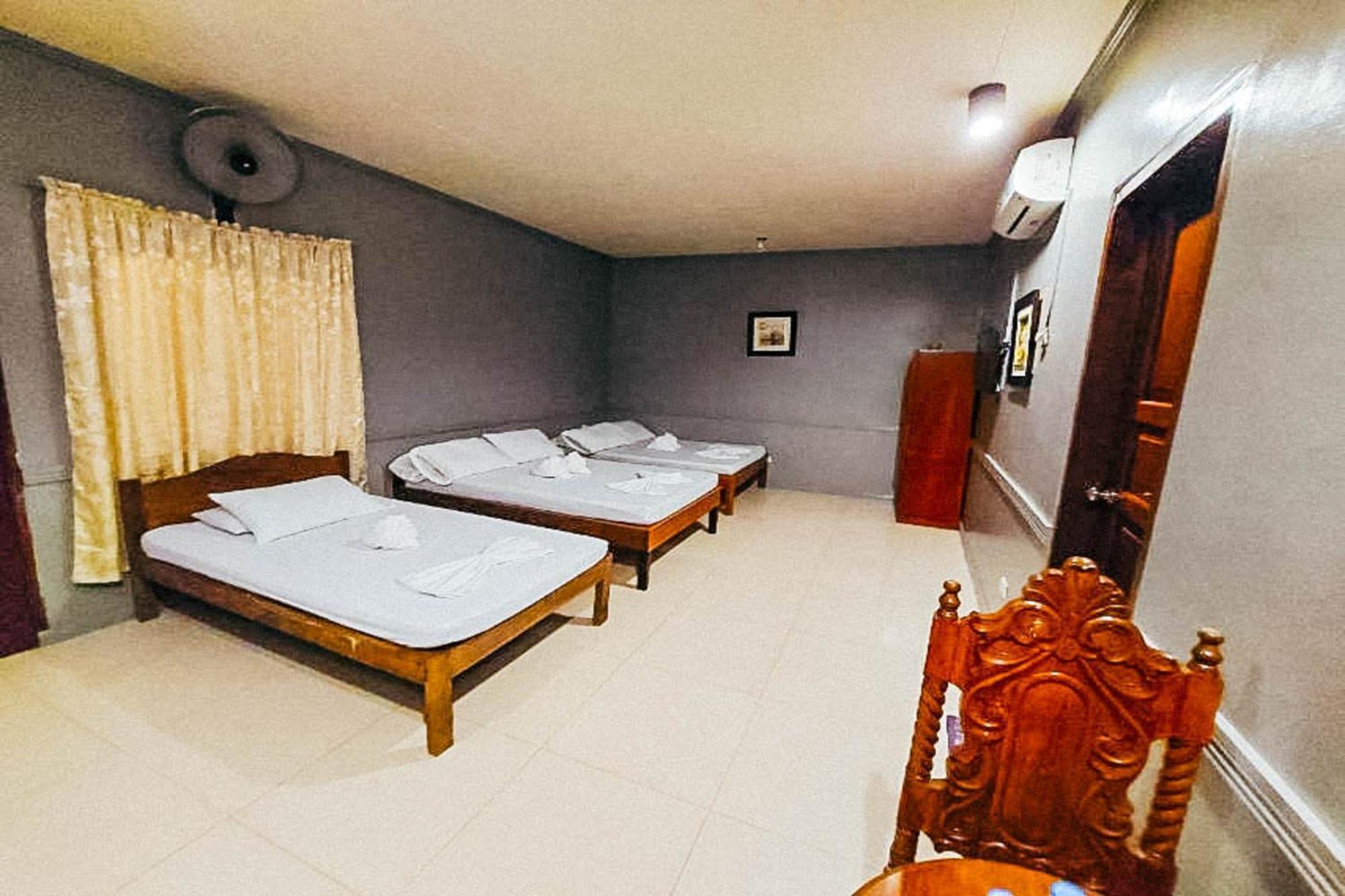 Mbg Travellers Inn Powered By Cocotel Puerto Princesa Habitación foto