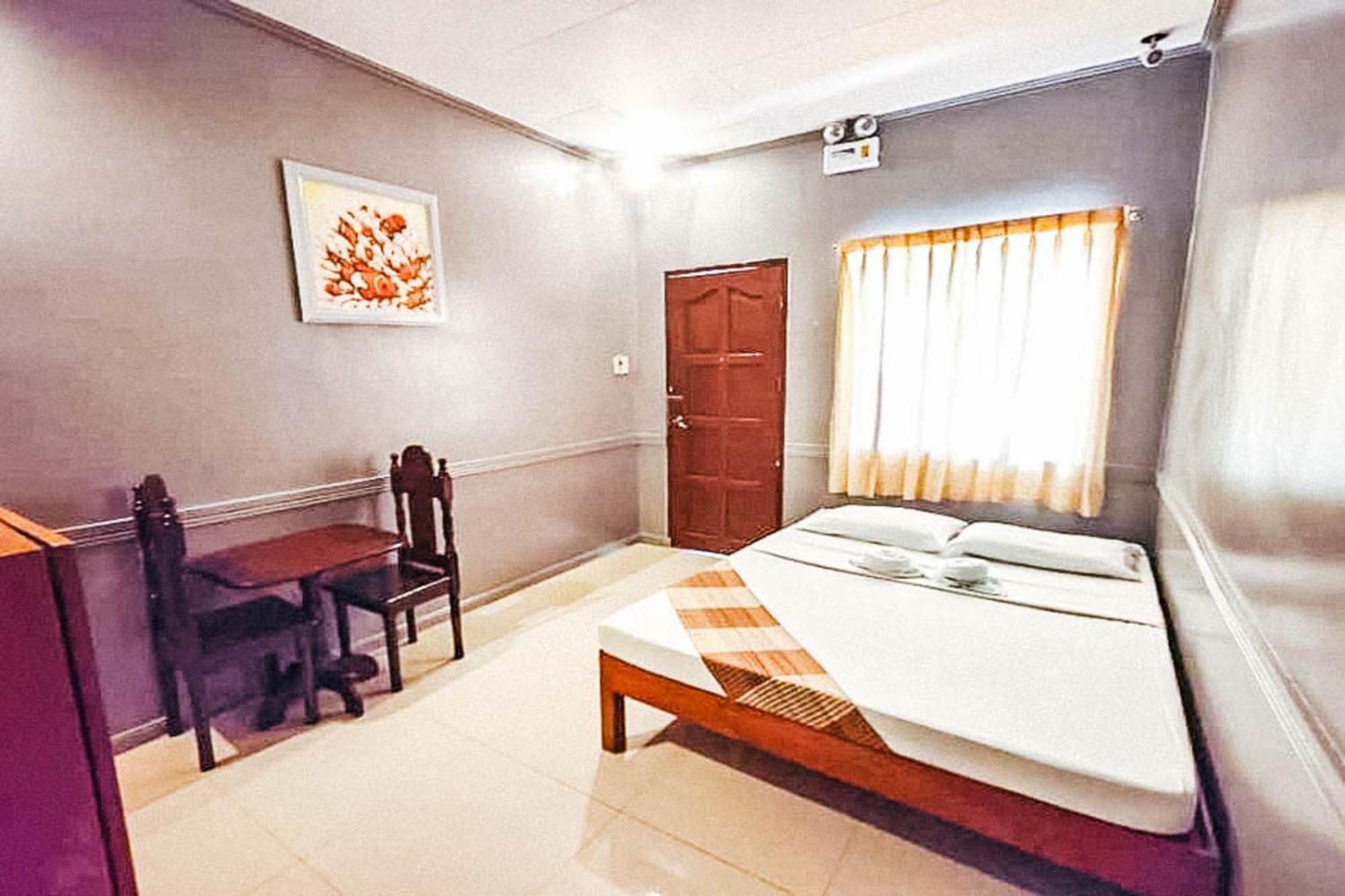 Mbg Travellers Inn Powered By Cocotel Puerto Princesa Habitación foto