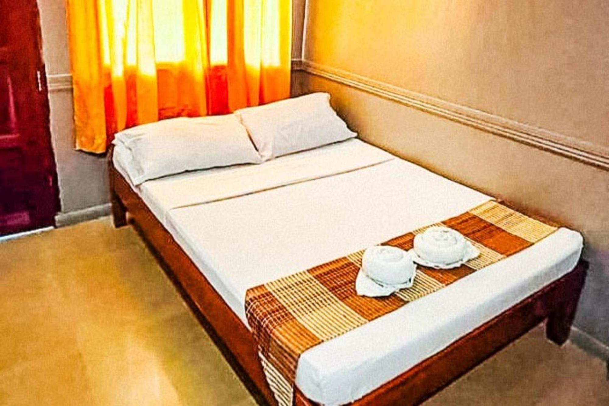 Mbg Travellers Inn Powered By Cocotel Puerto Princesa Habitación foto